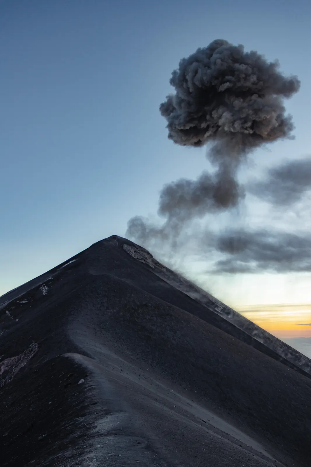Fuego volcano erupting at dusk seen from Acatenango base camp
